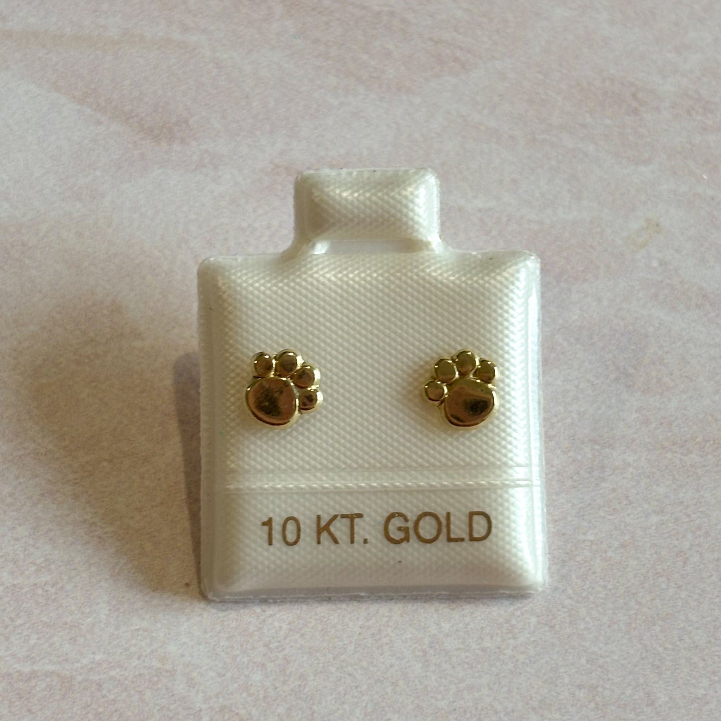 Piercing oro Huellitas